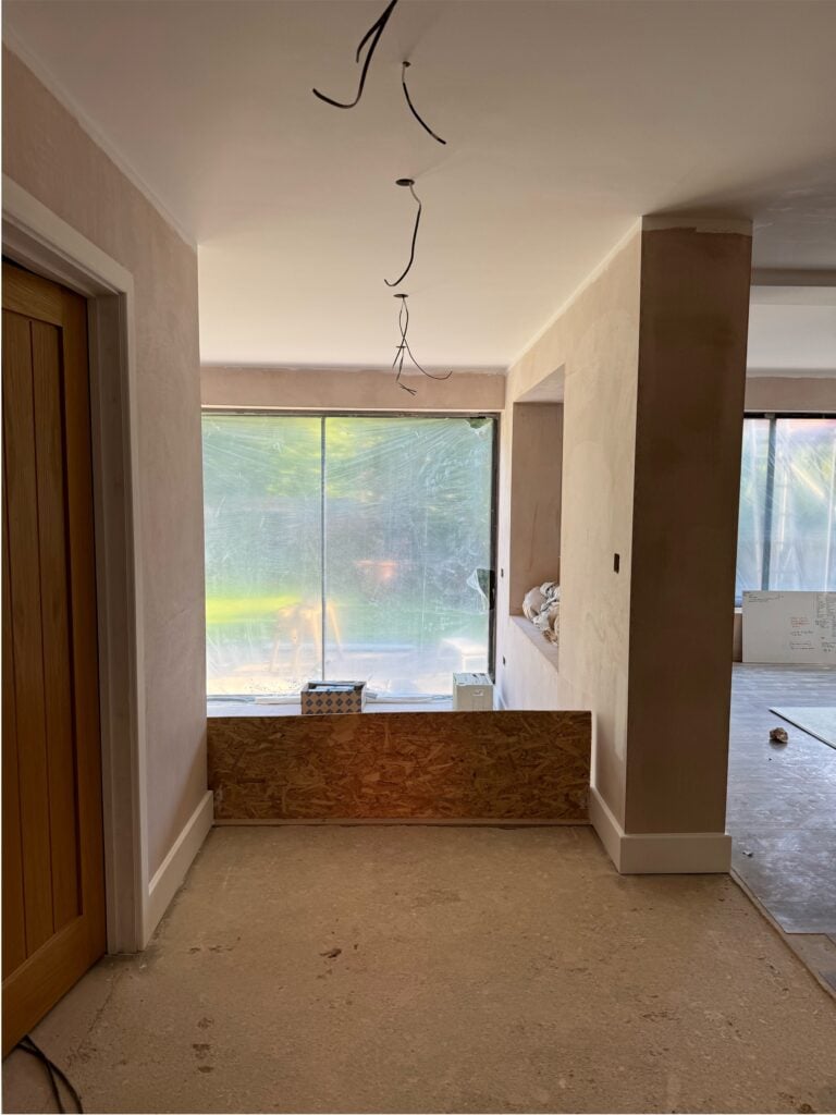 Unfinished interior space under renovation at a residential property in St Albans, Hertfordshire, featuring ongoing drywall work by Randa Kort Interior Design.